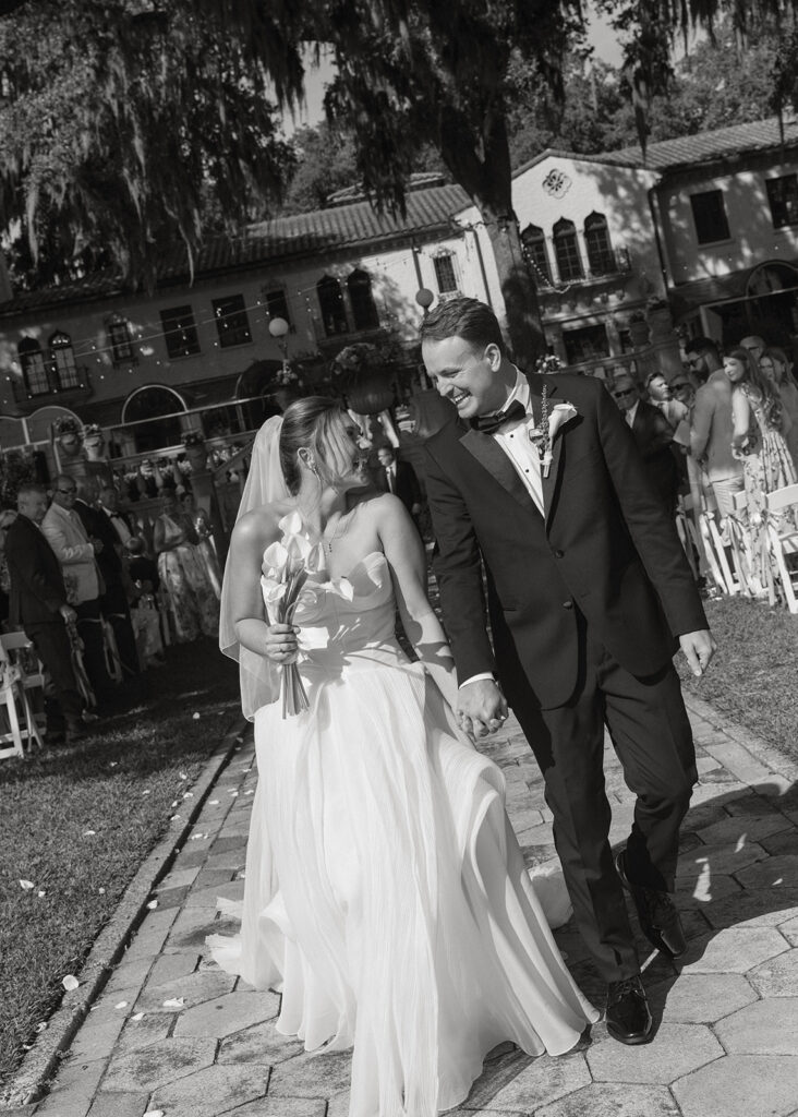 Matt and Samantha walking along the waterfront patio at Epping Forest Yacht & Country Club