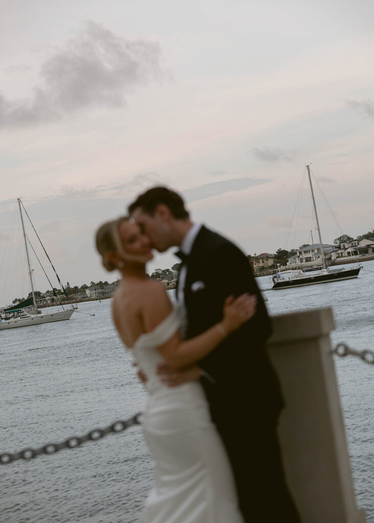 Bride and groom's sunset kiss on the water in St. Augustine, Florida