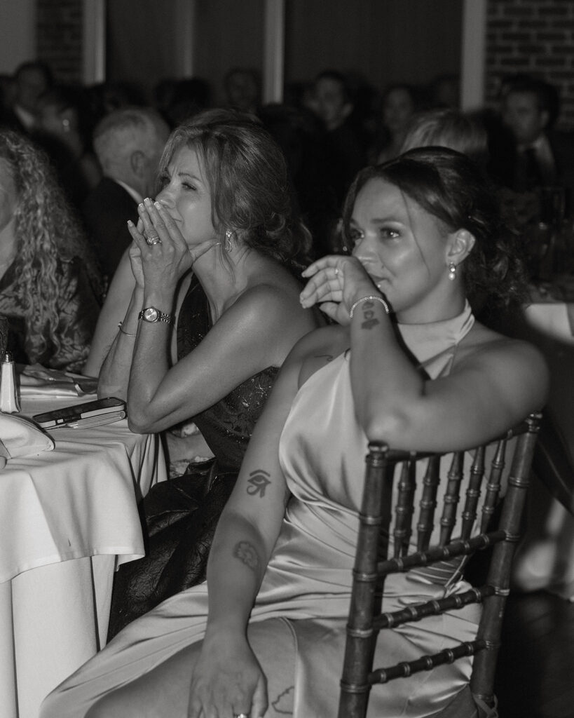 Guests reacting emotionally during toasts at the St. Augustine, Florida wedding reception