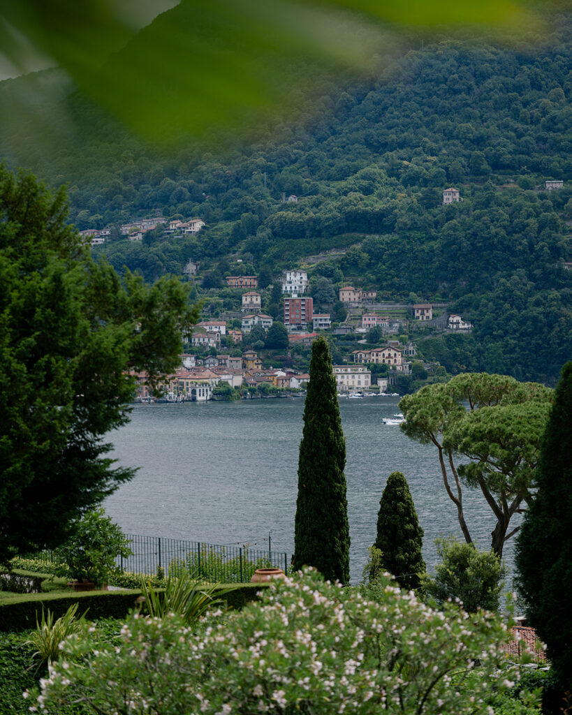 Aerial view of Lake Como with lakeside villages and cypress trees