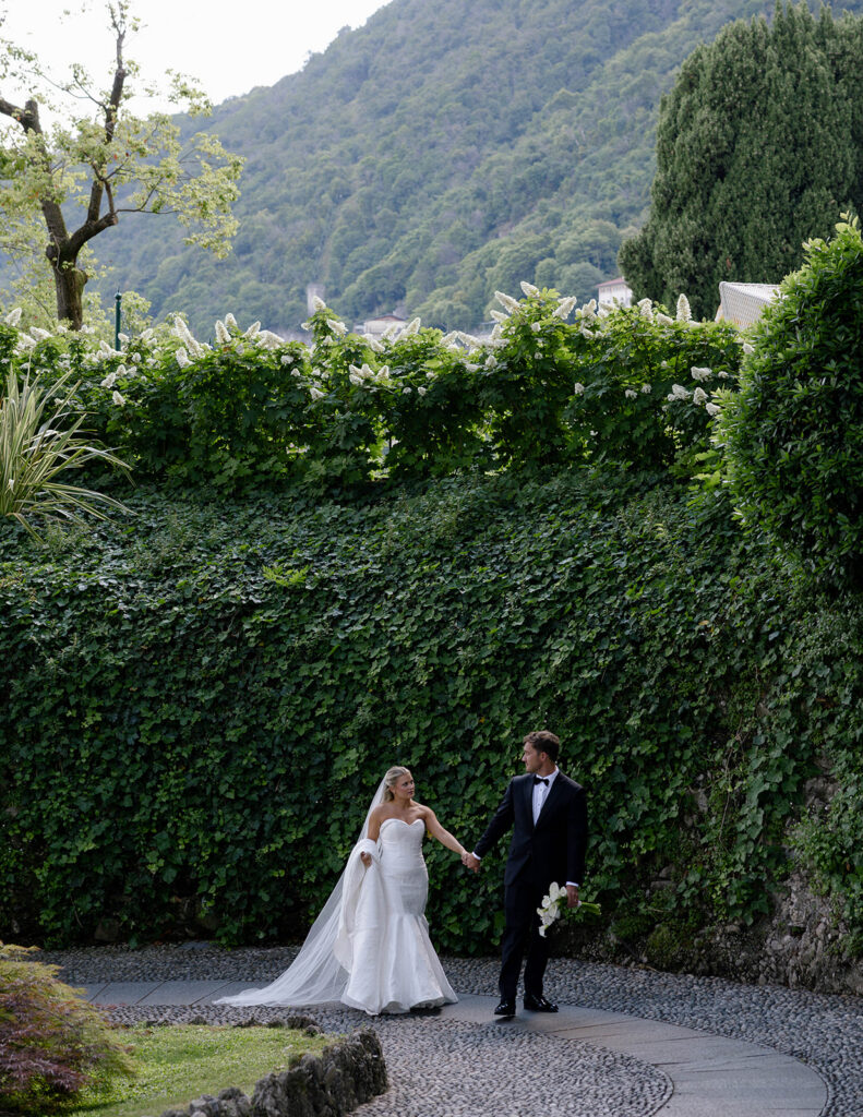 Green hillside and cypress trees overlooking Lake Como