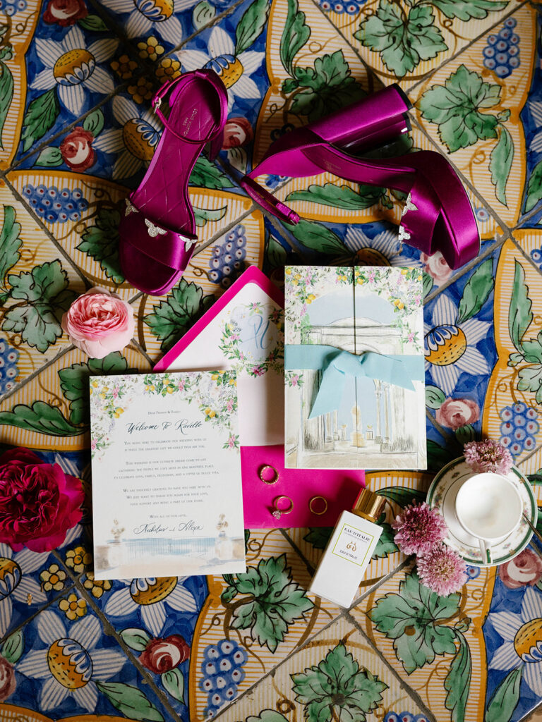 Purple satin heels and invitation suite flat lay, Villa Cimbrone wedding