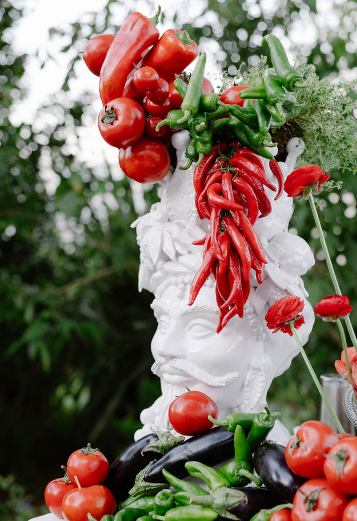 Decorative pepper and vegetable display at an Italian wedding welcome party