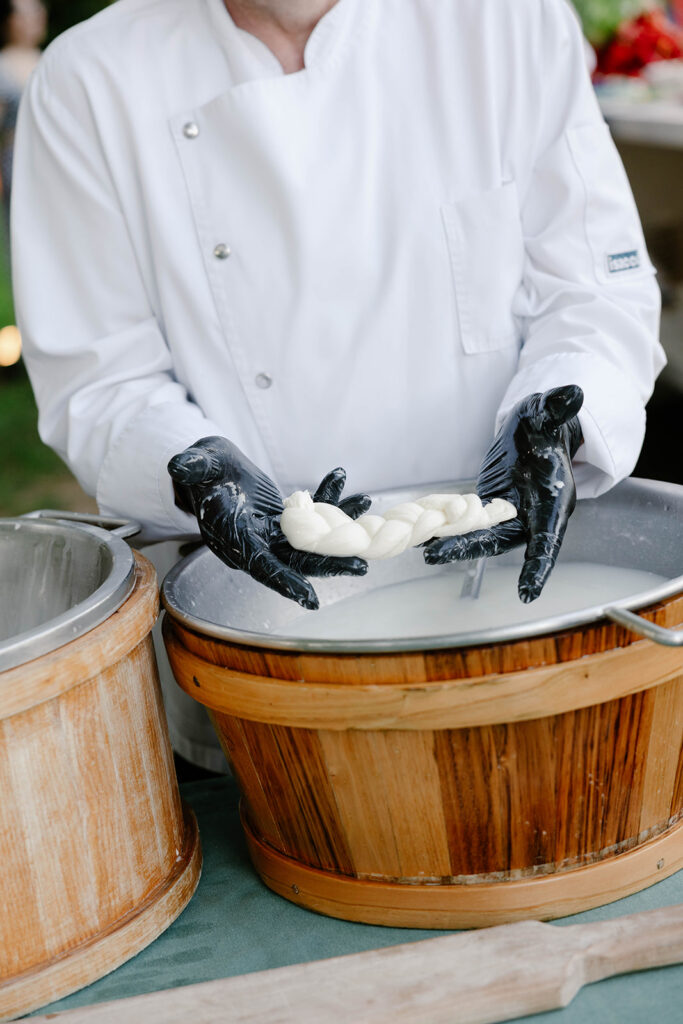 Chef hand-pulling fresh mozzarella for a Villa Cimbrone wedding welcome dinner