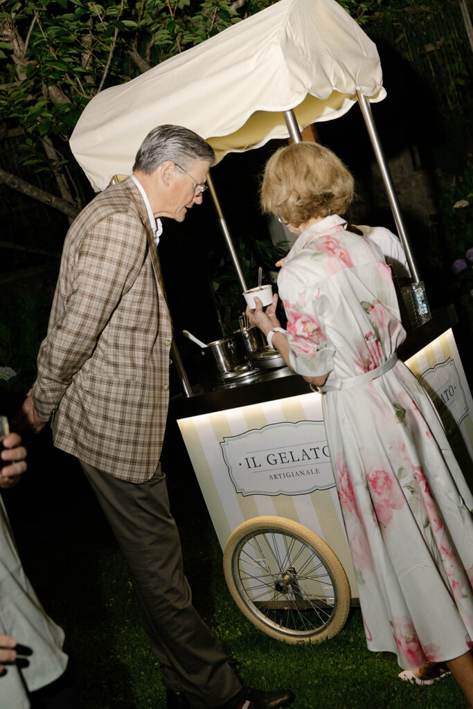 Guests at a vintage gelato cart during a Villa Cimbrone wedding welcome party